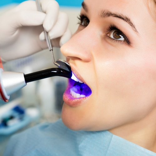 a woman getting a dental filling